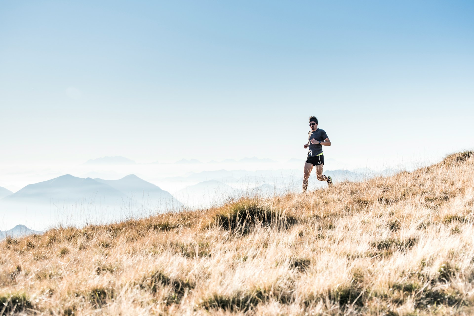 A runner on a mountain ridge